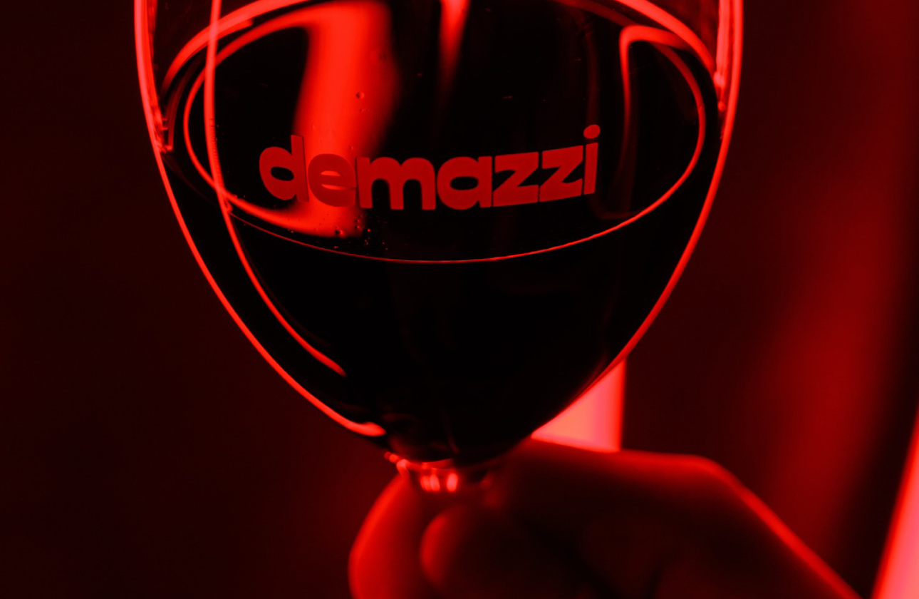 Wine Glass with the Demazzi logo printed on it.